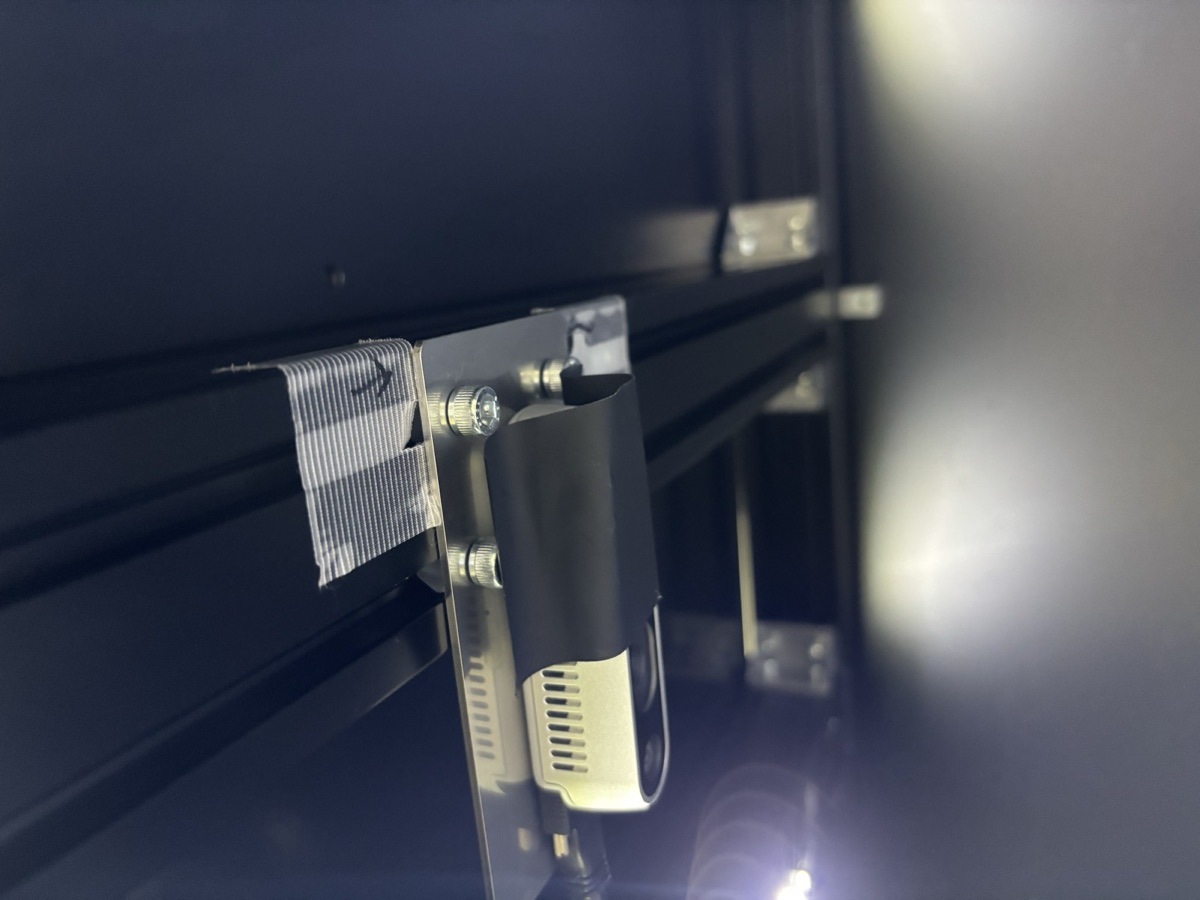 Overhead RealSense D435 under the ceiling extrusion with its lens covered