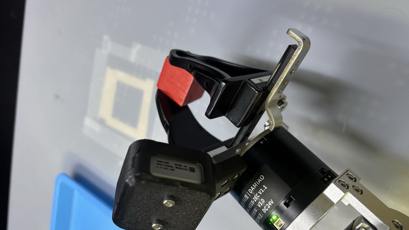 Follower gripper jaws stopped on a red cube.