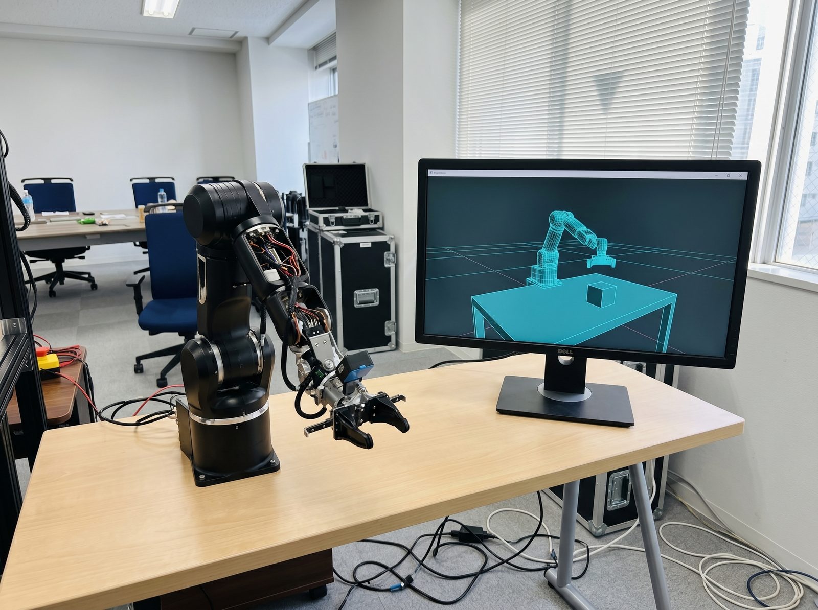 Robot arm beside Isaac Sim simulation showing reward heatmap and trajectory traces